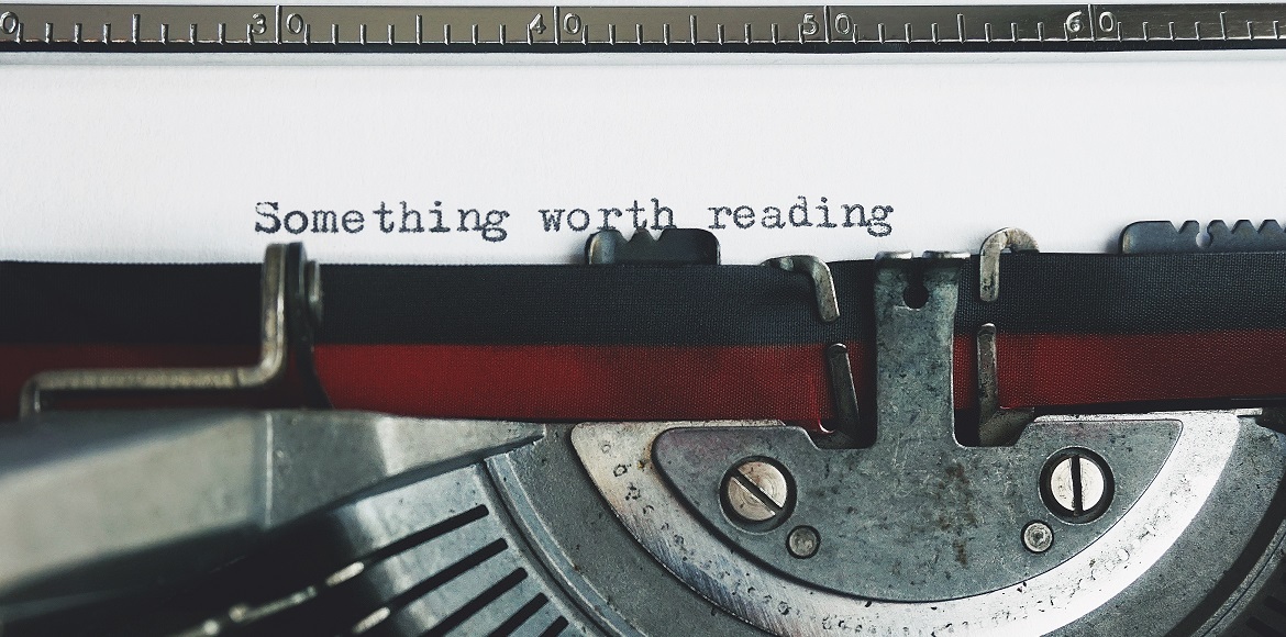 typewriter that reads 'something worth reading'