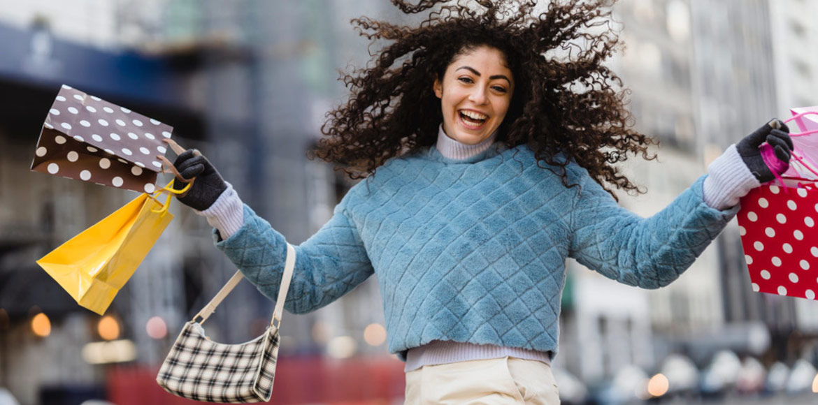 woman showing off her shopping purchases