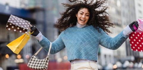 woman showing off her shopping purchases