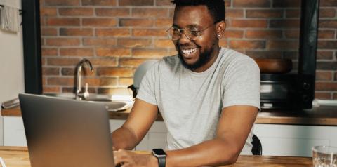 guy smiling at computer
